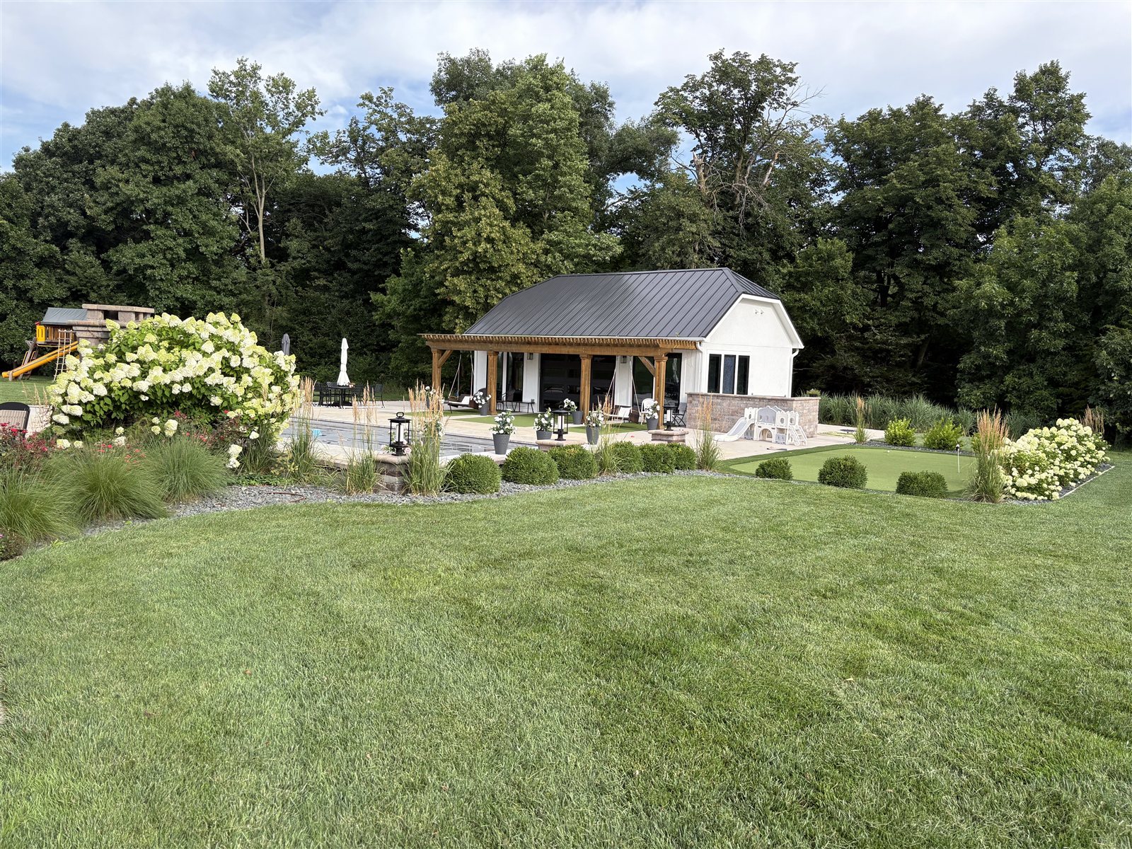 Ankeny, Iowa — backyard pool house and landscaping
